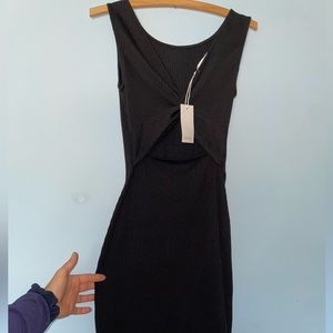 Sexy black body-con mid length dress size Small with stunning cutout